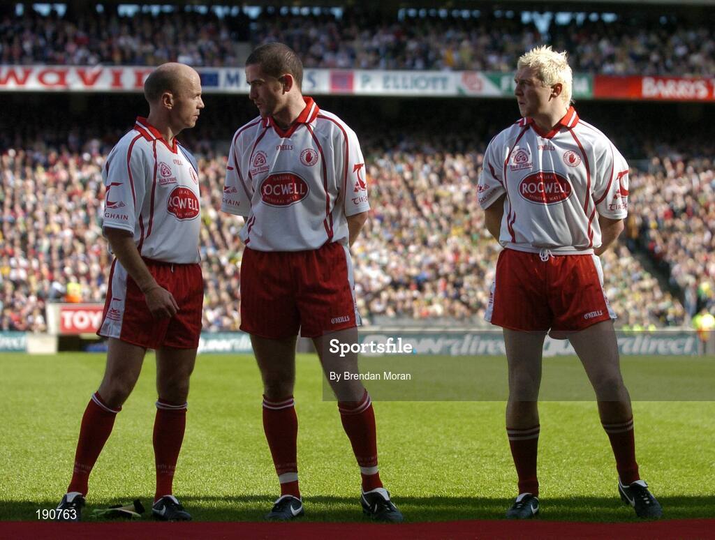 25 September 2005; Tyrone players Peter Canavan, left, and Stephen O'Neill and Owen Mulligan, right, in conversation before the game. Bank of Ireland All-Ireland Senior Football Championship Final, Kerry v Tyrone, Croke Park, Dublin. Picture credit; Brendan Moran / SPORTSFILE *** Local Caption *** Any photograph taken by SPORTSFILE during, or in connection with, the 2005 Bank of Ireland All-Ireland Senior Football Final which displays GAA logos or contains an image or part of an image of any GAA intellectual property, or, which contains images of a GAA player/players in their playing uniforms, may only be used for editorial and non-advertising purposes.  Use of photographs for advertising, as posters or for purchase separately is strictly prohibited unless prior written approval has been obtained from the Gaelic Athletic Association.
