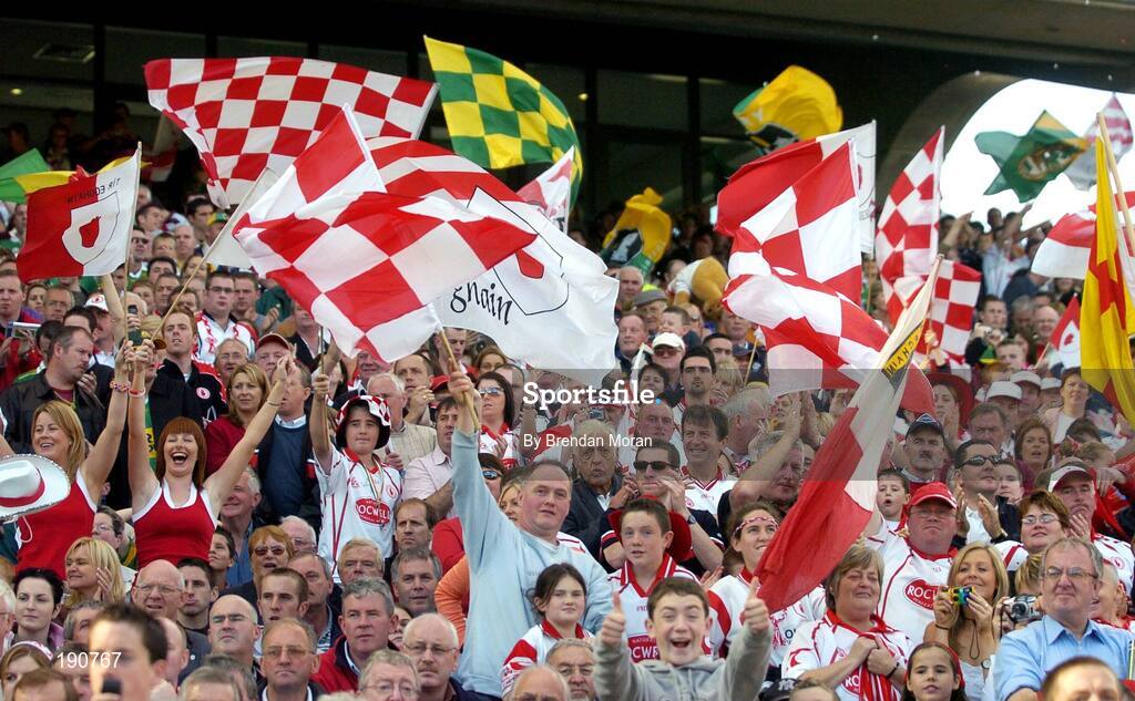 25 September 2005; Tyrone and Kerry fans cheer on their side before the game. Bank of Ireland All-Ireland Senior Football Championship Final, Kerry v Tyrone, Croke Park, Dublin. Picture credit; Brendan Moran / SPORTSFILE *** Local Caption *** Any photograph taken by SPORTSFILE during, or in connection with, the 2005 Bank of Ireland All-Ireland Senior Football Final which displays GAA logos or contains an image or part of an image of any GAA intellectual property, or, which contains images of a GAA player/players in their playing uniforms, may only be used for editorial and non-advertising purposes.  Use of photographs for advertising, as posters or for purchase separately is strictly prohibited unless prior written approval has been obtained from the Gaelic Athletic Association.