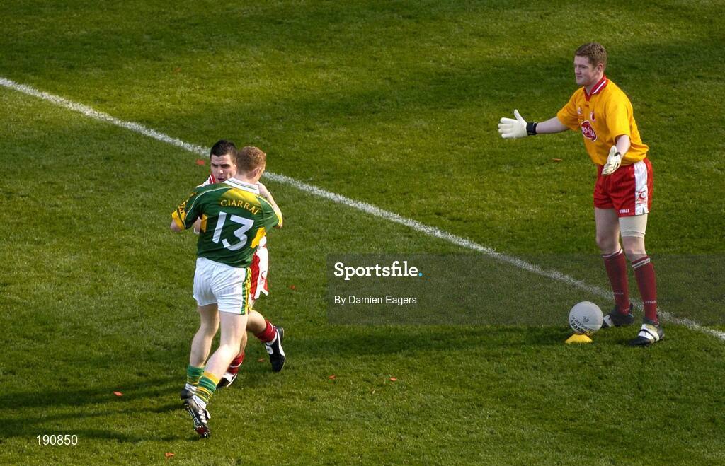 25 September 2005; Kerry's Colm Cooper is blocked by Tyrone's Michael McGee as Tyrone goalkeeper Pascal McConnell takes the kick out. Bank of Ireland All-Ireland Senior Football Championship Final, Kerry v Tyrone, Croke Park, Dublin. Picture credit; Damien Eagers/ SPORTSFILE *** Local Caption *** Any photograph taken by SPORTSFILE during, or in connection with, the 2005 Bank of Ireland All-Ireland Senior Football Final which displays GAA logos or contains an image or part of an image of any GAA intellectual property, or, which contains images of a GAA player/players in their playing uniforms, may only be used for editorial and non-advertising purposes.  Use of photographs for advertising, as posters or for purchase separately is strictly prohibited unless prior written approval has been obtained from the Gaelic Athletic Association.
