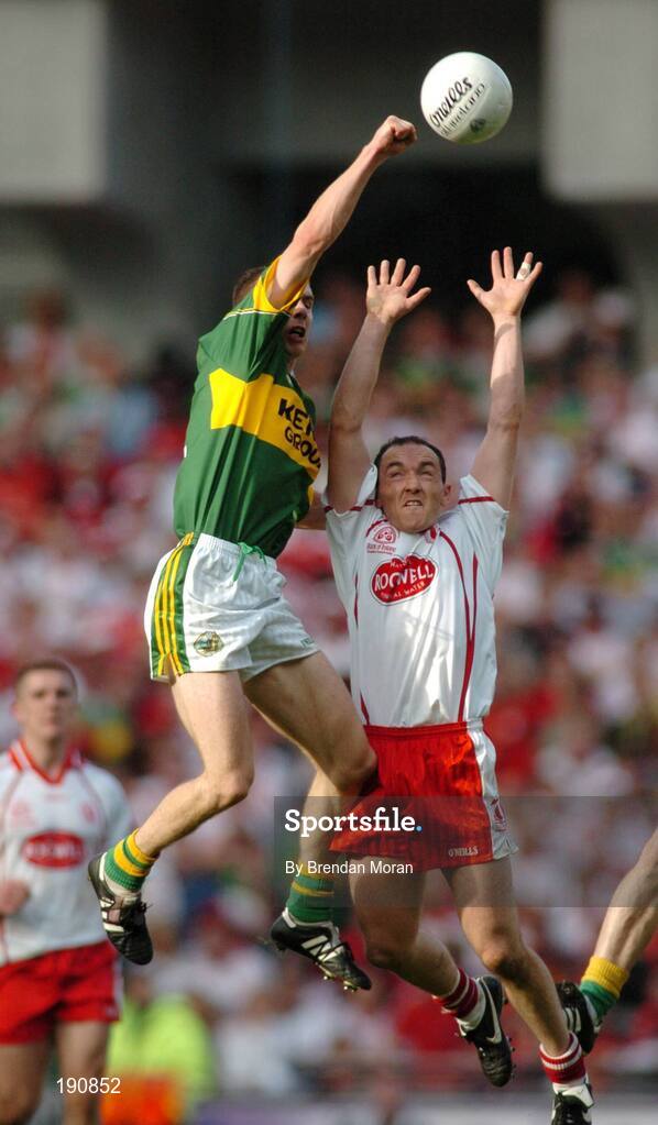 25 September 2005; Marc O Se, Kerry, in action against Brian Dooher, Tyrone. Bank of Ireland All-Ireland Senior Football Championship Final, Kerry v Tyrone, Croke Park, Dublin. Picture credit; Brendan Moran / SPORTSFILE *** Local Caption *** Any photograph taken by SPORTSFILE during, or in connection with, the 2005 Bank of Ireland All-Ireland Senior Football Final which displays GAA logos or contains an image or part of an image of any GAA intellectual property, or, which contains images of a GAA player/players in their playing uniforms, may only be used for editorial and non-advertising purposes.  Use of photographs for advertising, as posters or for purchase separately is strictly prohibited unless prior written approval has been obtained from the Gaelic Athletic Association.