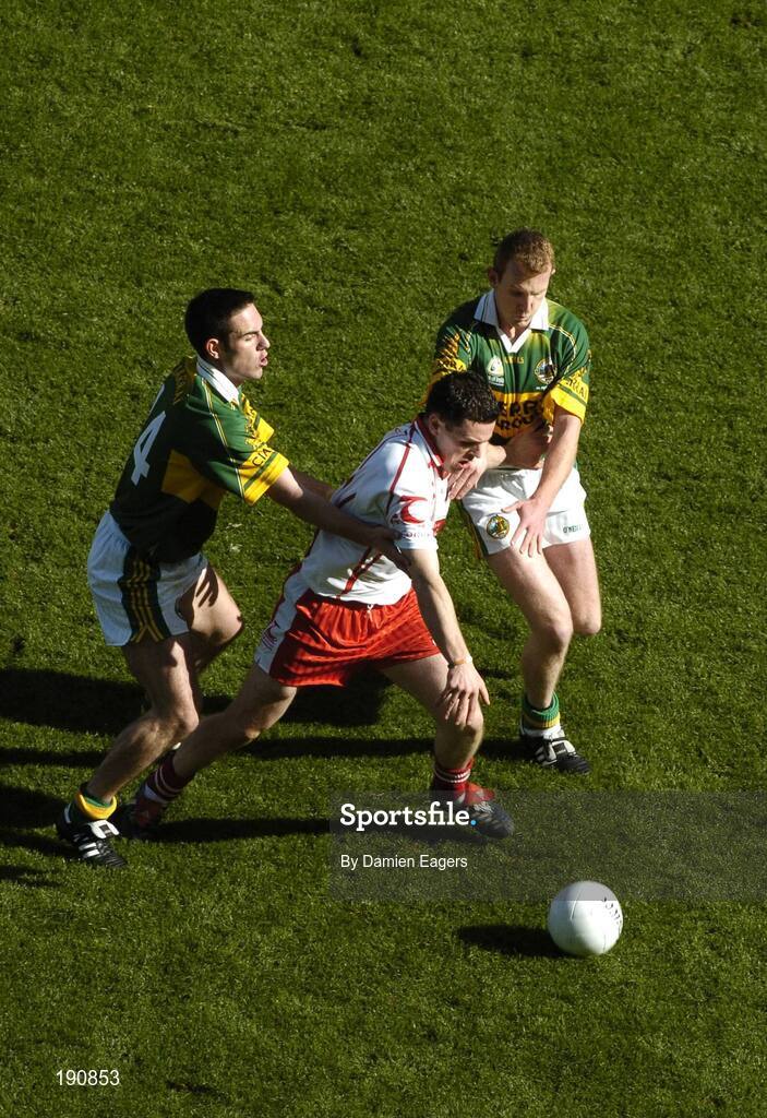 25 September 2005; Conor Gormley, Tyrone, in action against Declan O'Sullivan, left, and Liam Hassett, Kerry. Bank of Ireland All-Ireland Senior Football Championship Final, Kerry v Tyrone, Croke Park, Dublin. Picture credit; Damien Eagers/ SPORTSFILE *** Local Caption *** Any photograph taken by SPORTSFILE during, or in connection with, the 2005 Bank of Ireland All-Ireland Senior Football Final which displays GAA logos or contains an image or part of an image of any GAA intellectual property, or, which contains images of a GAA player/players in their playing uniforms, may only be used for editorial and non-advertising purposes.  Use of photographs for advertising, as posters or for purchase separately is strictly prohibited unless prior written approval has been obtained from the Gaelic Athletic Association.