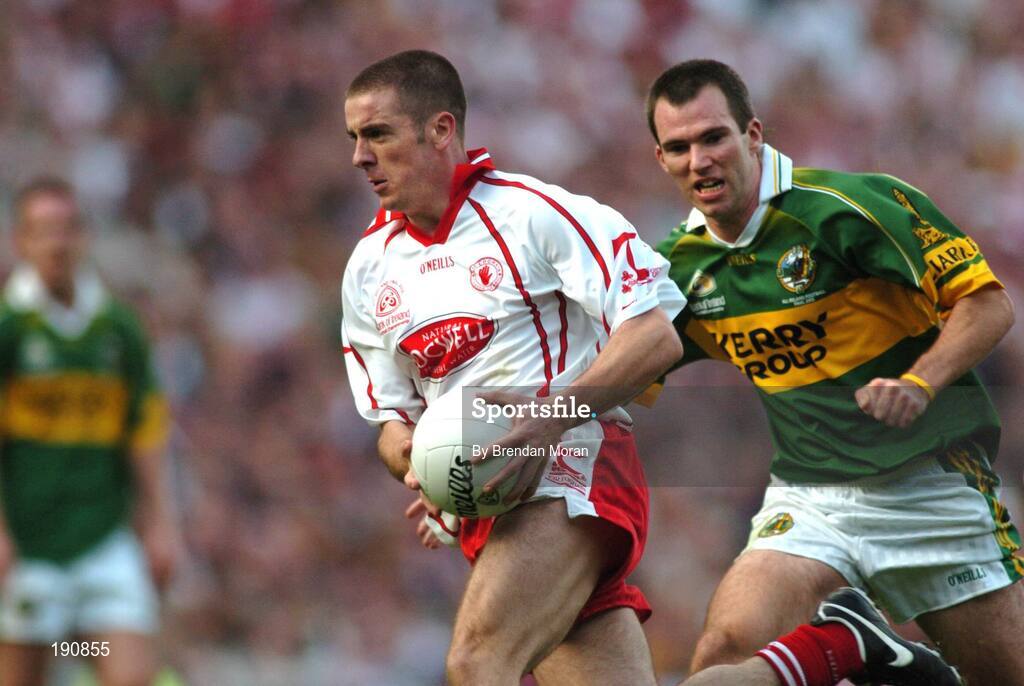 25 September 2005; Philip Jordan, Tyrone, in action against Michael McCarthy, Kerry. Bank of Ireland All-Ireland Senior Football Championship Final, Kerry v Tyrone, Croke Park, Dublin. Picture credit; Brendan Moran / SPORTSFILE *** Local Caption *** Any photograph taken by SPORTSFILE during, or in connection with, the 2005 Bank of Ireland All-Ireland Senior Football Final which displays GAA logos or contains an image or part of an image of any GAA intellectual property, or, which contains images of a GAA player/players in their playing uniforms, may only be used for editorial and non-advertising purposes.  Use of photographs for advertising, as posters or for purchase separately is strictly prohibited unless prior written approval has been obtained from the Gaelic Athletic Association.