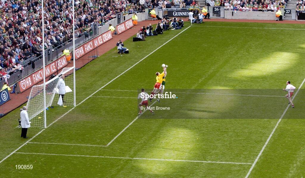 25 September 2005; Tyrone goalkeeper Pascal McConnell gets to the ball ahead of Colm Cooper, Kerry. Bank of Ireland All-Ireland Senior Football Championship Final, Kerry v Tyrone, Croke Park, Dublin. Picture credit; Matt Browne / SPORTSFILE *** Local Caption *** Any photograph taken by SPORTSFILE during, or in connection with, the 2005 Bank of Ireland All-Ireland Senior Football Final which displays GAA logos or contains an image or part of an image of any GAA intellectual property, or, which contains images of a GAA player/players in their playing uniforms, may only be used for editorial and non-advertising purposes.  Use of photographs for advertising, as posters or for purchase separately is strictly prohibited unless prior written approval has been obtained from the Gaelic Athletic Association.