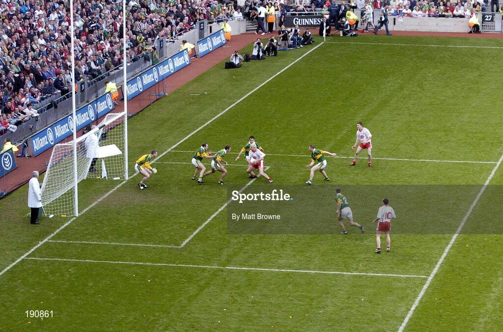 25 September 2005; Owen Mulligan, Tyrone, in possession, is put under pressure by the Kerry defence. Bank of Ireland All-Ireland Senior Football Championship Final, Kerry v Tyrone, Croke Park, Dublin. Picture credit; Matt Browne / SPORTSFILE *** Local Caption *** Any photograph taken by SPORTSFILE during, or in connection with, the 2005 Bank of Ireland All-Ireland Senior Football Final which displays GAA logos or contains an image or part of an image of any GAA intellectual property, or, which contains images of a GAA player/players in their playing uniforms, may only be used for editorial and non-advertising purposes.  Use of photographs for advertising, as posters or for purchase separately is strictly prohibited unless prior written approval has been obtained from the Gaelic Athletic Association.