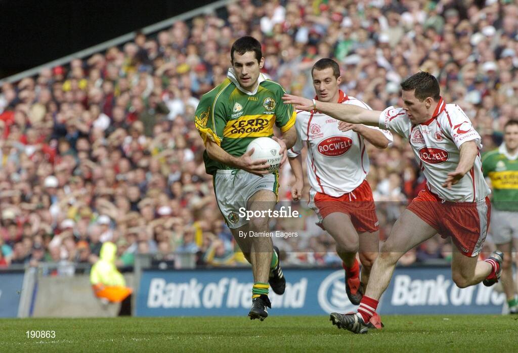 25 September 2005; Tom O'Sullivan, Kerry, in action against Conor Gormley, right, and Brian McGuigan,Tyrone. Bank of Ireland All-Ireland Senior Football Championship Final, Kerry v Tyrone, Croke Park, Dublin. Picture credit; Damien Eagers/ SPORTSFILE *** Local Caption *** Any photograph taken by SPORTSFILE during, or in connection with, the 2005 Bank of Ireland All-Ireland Senior Football Final which displays GAA logos or contains an image or part of an image of any GAA intellectual property, or, which contains images of a GAA player/players in their playing uniforms, may only be used for editorial and non-advertising purposes.  Use of photographs for advertising, as posters or for purchase separately is strictly prohibited unless prior written approval has been obtained from the Gaelic Athletic Association.