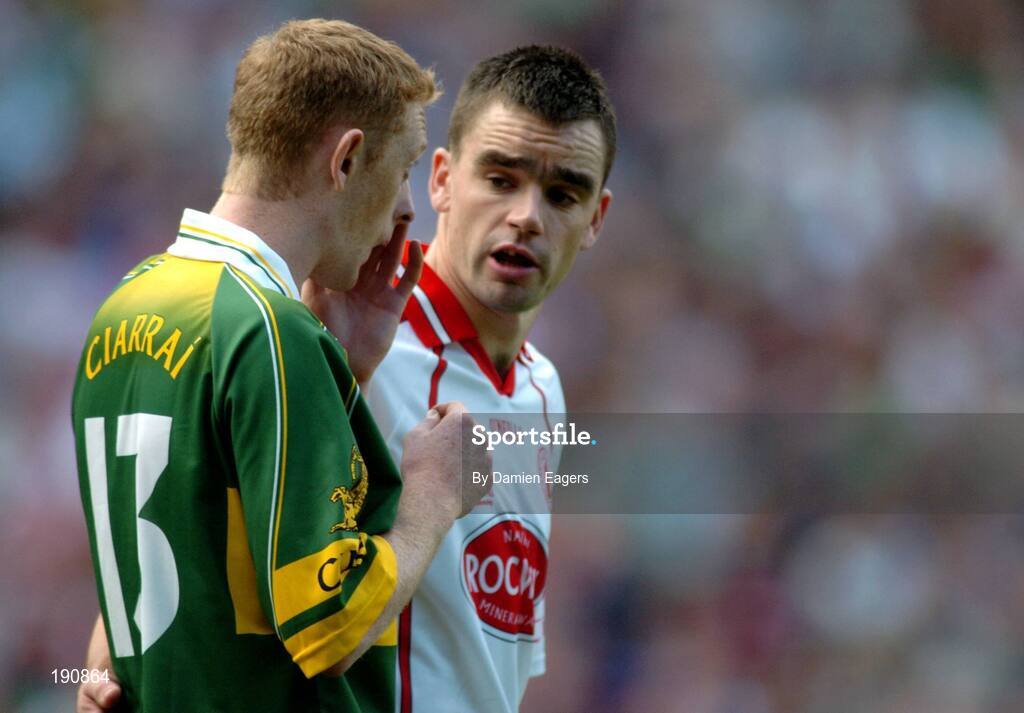 25 September 2005; Ryan McMenamin, Tyrone, speaks to Kerry's Colm Cooper during the match. Bank of Ireland All-Ireland Senior Football Championship Final, Kerry v Tyrone, Croke Park, Dublin. Picture credit; Damien Eagers/ SPORTSFILE *** Local Caption *** Any photograph taken by SPORTSFILE during, or in connection with, the 2005 Bank of Ireland All-Ireland Senior Football Final which displays GAA logos or contains an image or part of an image of any GAA intellectual property, or, which contains images of a GAA player/players in their playing uniforms, may only be used for editorial and non-advertising purposes.  Use of photographs for advertising, as posters or for purchase separately is strictly prohibited unless prior written approval has been obtained from the Gaelic Athletic Association.