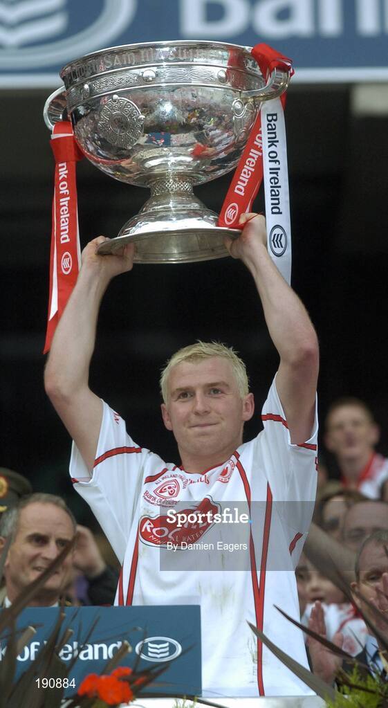 25 September 2005; Owen Mulligan, Tyrone lifts the Sam Maguire, Bank of Ireland All-Ireland Senior Football Championship Final, Kerry v Tyrone, Croke Park, Dublin. Picture credit; Damien Eagers/ SPORTSFILE *** Local Caption *** Any photograph taken by SPORTSFILE during, or in connection with, the 2005 Bank of Ireland All-Ireland Senior Football Final which displays GAA logos or contains an image or part of an image of any GAA intellectual property, or, which contains images of a GAA player/players in their playing uniforms, may only be used for editorial and non-advertising purposes.  Use of photographs for advertising, as posters or for purchase separately is strictly prohibited unless prior written approval has been obtained from the Gaelic Athletic Association.