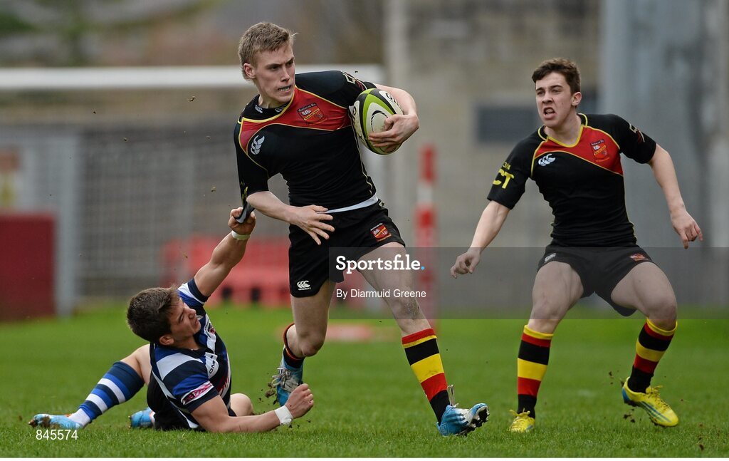17 March 2014; Paul McNamara, Ardscoil Ris, supported by team-mate Liam Brock, is tackled by Fionn McGibney, Crescent College. SEAT Munster Schools Senior Cup Final, Ard Scoil Ris v Crescent College Comprehensive, Thomond Park, Limerick. Picture credit: Diarmuid Greene / SPORTSFILE