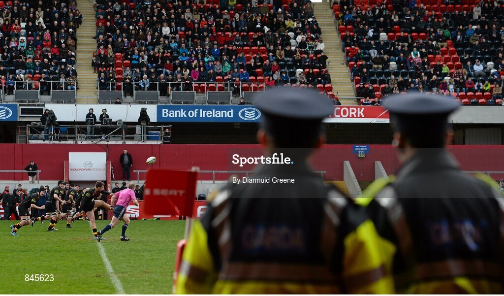 17 March 2014; Two members of an Garda Siochana look on as David O'Mahony, Ardscoil Ris, kicks a restart. SEAT Munster Schools Senior Cup Final, Ard Scoil Ris v Crescent College Comprehensive, Thomond Park, Limerick. Picture credit: Diarmuid Greene / SPORTSFILE