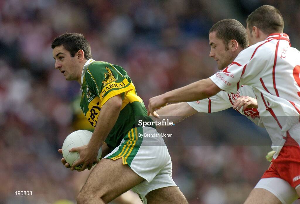 25 September 2005; Aidan O'Mahony, Kerry, in action against Stephen O'Neill and Sean Cavanagh, Tyrone. Bank of Ireland All-Ireland Senior Football Championship Final, Kerry v Tyrone, Croke Park, Dublin. Picture credit; Brendan Moran / SPORTSFILE *** Local Caption *** Any photograph taken by SPORTSFILE during, or in connection with, the 2005 Bank of Ireland All-Ireland Senior Football Final which displays GAA logos or contains an image or part of an image of any GAA intellectual property, or, which contains images of a GAA player/players in their playing uniforms, may only be used for editorial and non-advertising purposes.  Use of photographs for advertising, as posters or for purchase separately is strictly prohibited unless prior written approval has been obtained from the Gaelic Athletic Association.