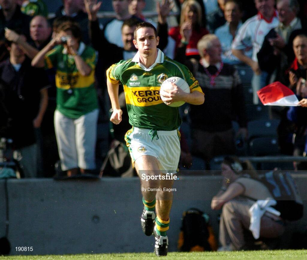 25 September 2005; Kerry captain Declan O'Sullivan runs onto the pitch. Bank of Ireland All-Ireland Senior Football Championship Final, Kerry v Tyrone, Croke Park, Dublin. Picture credit; Damien Eagers/ SPORTSFILE *** Local Caption *** Any photograph taken by SPORTSFILE during, or in connection with, the 2005 Bank of Ireland All-Ireland Senior Football Final which displays GAA logos or contains an image or part of an image of any GAA intellectual property, or, which contains images of a GAA player/players in their playing uniforms, may only be used for editorial and non-advertising purposes.  Use of photographs for advertising, as posters or for purchase separately is strictly prohibited unless prior written approval has been obtained from the Gaelic Athletic Association.