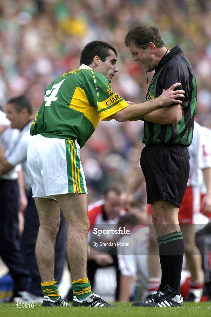 25 September 2005; Tom O'Sullivan, Kerry, is spoken to by referee Michael Monahan before receiving a yellow card. Bank of Ireland All-Ireland Senior Football Championship Final, Kerry v Tyrone, Croke Park, Dublin. Picture credit; Brendan Moran / SPORTSFILE *** Local Caption *** Any photograph taken by SPORTSFILE during, or in connection with, the 2005 Bank of Ireland All-Ireland Senior Football Final which displays GAA logos or contains an image or part of an image of any GAA intellectual property, or, which contains images of a GAA player/players in their playing uniforms, may only be used for editorial and non-advertising purposes.  Use of photographs for advertising, as posters or for purchase separately is strictly prohibited unless prior written approval has been obtained from the Gaelic Athletic Association.