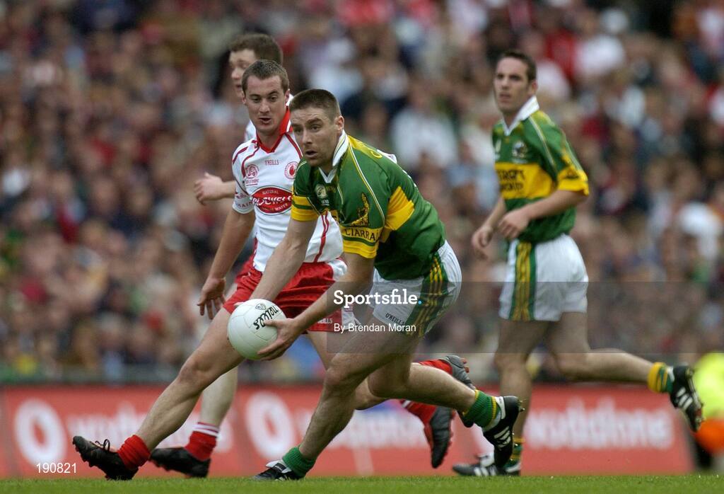 25 September 2005; Darragh O Se, Kerry, in action against Brian McGuigan, Tyrone. Bank of Ireland All-Ireland Senior Football Championship Final, Kerry v Tyrone, Croke Park, Dublin. Picture credit; Brendan Moran / SPORTSFILE *** Local Caption *** Any photograph taken by SPORTSFILE during, or in connection with, the 2005 Bank of Ireland All-Ireland Senior Football Final which displays GAA logos or contains an image or part of an image of any GAA intellectual property, or, which contains images of a GAA player/players in their playing uniforms, may only be used for editorial and non-advertising purposes.  Use of photographs for advertising, as posters or for purchase separately is strictly prohibited unless prior written approval has been obtained from the Gaelic Athletic Association.