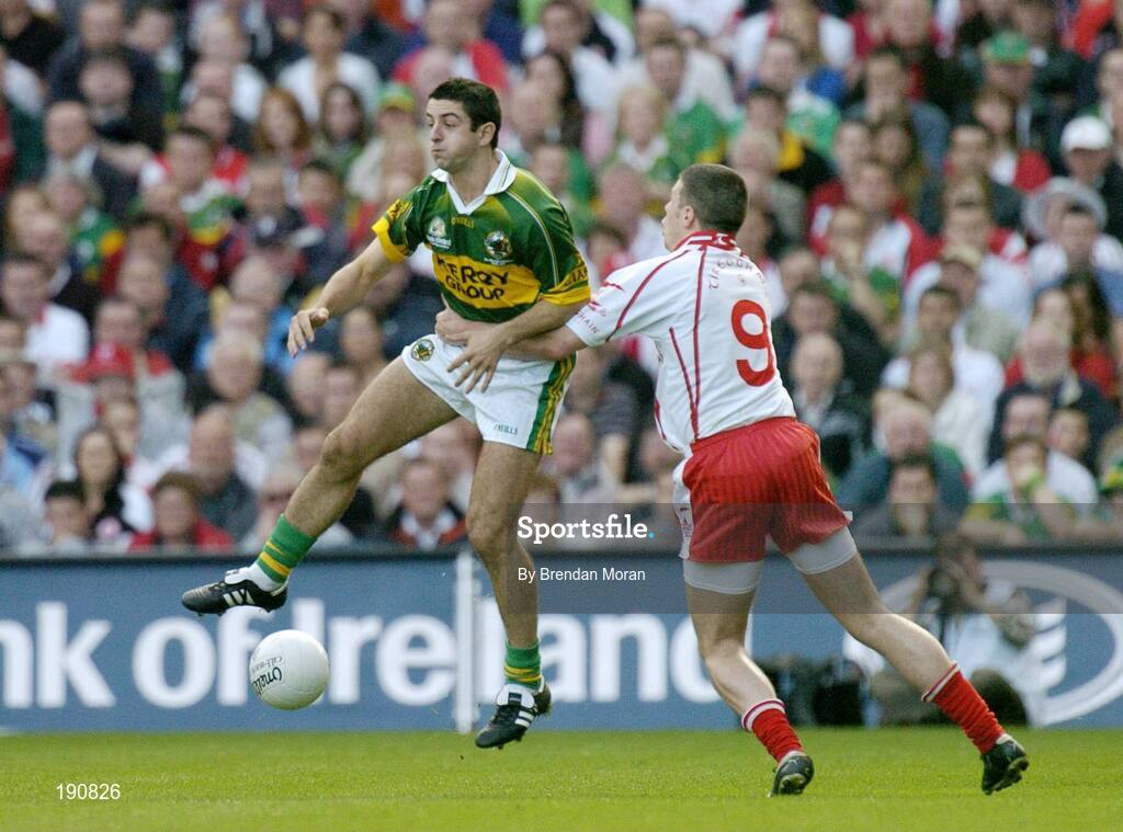 25 September 2005; Aidan O'Mahony, Kerry, in action against Sean Cavanagh, Tyrone. Bank of Ireland All-Ireland Senior Football Championship Final, Kerry v Tyrone, Croke Park, Dublin. Picture credit; Brendan Moran / SPORTSFILE *** Local Caption *** Any photograph taken by SPORTSFILE during, or in connection with, the 2005 Bank of Ireland All-Ireland Senior Football Final which displays GAA logos or contains an image or part of an image of any GAA intellectual property, or, which contains images of a GAA player/players in their playing uniforms, may only be used for editorial and non-advertising purposes.  Use of photographs for advertising, as posters or for purchase separately is strictly prohibited unless prior written approval has been obtained from the Gaelic Athletic Association.