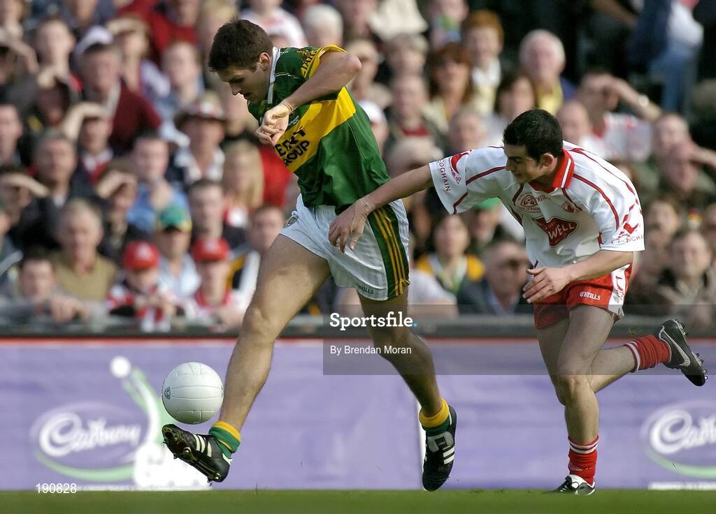 25 September 2005; Eoin Brosnan, Kerry, in action against Davy Harte, Tyrone. Bank of Ireland All-Ireland Senior Football Championship Final, Kerry v Tyrone, Croke Park, Dublin. Picture credit; Brendan Moran / SPORTSFILE *** Local Caption *** Any photograph taken by SPORTSFILE during, or in connection with, the 2005 Bank of Ireland All-Ireland Senior Football Final which displays GAA logos or contains an image or part of an image of any GAA intellectual property, or, which contains images of a GAA player/players in their playing uniforms, may only be used for editorial and non-advertising purposes.  Use of photographs for advertising, as posters or for purchase separately is strictly prohibited unless prior written approval has been obtained from the Gaelic Athletic Association.