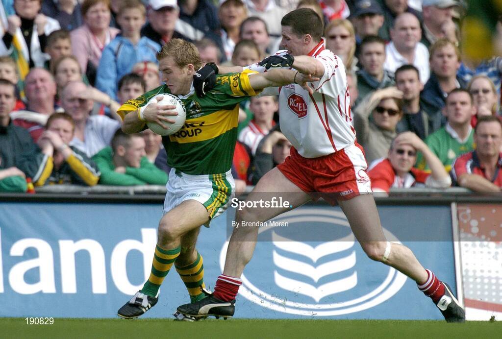 25 September 2005; Darren O'Sullivan, Kerry, in action against Colin Holmes, Tyrone. Bank of Ireland All-Ireland Senior Football Championship Final, Kerry v Tyrone, Croke Park, Dublin. Picture credit; Brendan Moran / SPORTSFILE *** Local Caption *** Any photograph taken by SPORTSFILE during, or in connection with, the 2005 Bank of Ireland All-Ireland Senior Football Final which displays GAA logos or contains an image or part of an image of any GAA intellectual property, or, which contains images of a GAA player/players in their playing uniforms, may only be used for editorial and non-advertising purposes.  Use of photographs for advertising, as posters or for purchase separately is strictly prohibited unless prior written approval has been obtained from the Gaelic Athletic Association.
