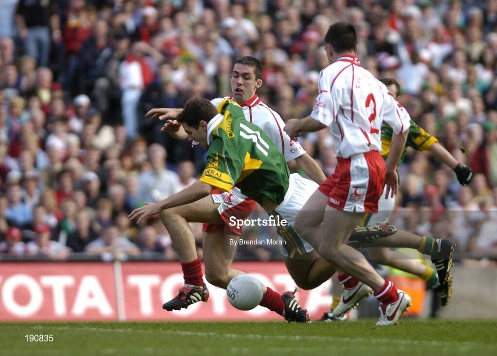 25 September 2005; Eoin Brosnan, Kerry, is tackled by Joe McMahon, Tyrone. Bank of Ireland All-Ireland Senior Football Championship Final, Kerry v Tyrone, Croke Park, Dublin. Picture credit; Brendan Moran / SPORTSFILE *** Local Caption *** Any photograph taken by SPORTSFILE during, or in connection with, the 2005 Bank of Ireland All-Ireland Senior Football Final which displays GAA logos or contains an image or part of an image of any GAA intellectual property, or, which contains images of a GAA player/players in their playing uniforms, may only be used for editorial and non-advertising purposes.  Use of photographs for advertising, as posters or for purchase separately is strictly prohibited unless prior written approval has been obtained from the Gaelic Athletic Association.