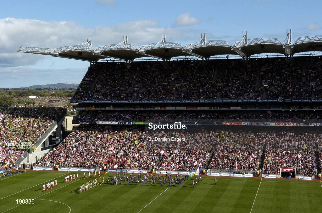 25 September 2005; A general view of Croke Park showing the Tyrone and Kerry teams during the pre match parade in front of the Cuasck Stand, Bank of Ireland All-Ireland Senior Football Championship Final, Kerry v Tyrone, Croke Park, Dublin. Picture credit; Damien Eagers/ SPORTSFILE *** Local Caption *** Any photograph taken by SPORTSFILE during, or in connection with, the 2005 Bank of Ireland All-Ireland Senior Football Final which displays GAA logos or contains an image or part of an image of any GAA intellectual property, or, which contains images of a GAA player/players in their playing uniforms, may only be used for editorial and non-advertising purposes.  Use of photographs for advertising, as posters or for purchase separately is strictly prohibited unless prior written approval has been obtained from the Gaelic Athletic Association.