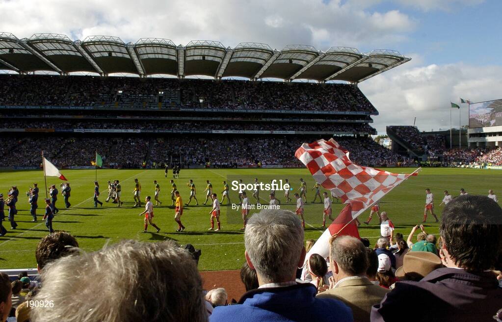 25 September 2005; The Tyrone and Kerry team's pass the Cusack stand during the prade before the start of the game. Bank of Ireland All-Ireland Senior Football Championship Final, Kerry v Tyrone, Croke Park, Dublin. Picture credit; Matt Browne / SPORTSFILE *** Local Caption *** Any photograph taken by SPORTSFILE during, or in connection with, the 2005 Bank of Ireland All-Ireland Senior Football Final which displays GAA logos or contains an image or part of an image of any GAA intellectual property, or, which contains images of a GAA player/players in their playing uniforms, may only be used for editorial and non-advertising purposes.  Use of photographs for advertising, as posters or for purchase separately is strictly prohibited unless prior written approval has been obtained from the Gaelic Athletic Association.