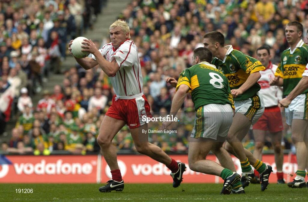 25 September 2005; Eoin Mulligan, Tyrone, in action against Kerry's Darragh O'Se and Marc O'Se. Bank of Ireland All-Ireland Senior Football Championship Final, Kerry v Tyrone, Croke Park, Dublin. Picture credit; Damien Eagers/ SPORTSFILE *** Local Caption *** Any photograph taken by SPORTSFILE during, or in connection with, the 2005 Bank of Ireland All-Ireland Senior Football Final which displays GAA logos or contains an image or part of an image of any GAA intellectual property, or, which contains images of a GAA player/players in their playing uniforms, may only be used for editorial and non-advertising purposes.  Use of photographs for advertising, as posters or for purchase separately is strictly prohibited unless prior written approval has been obtained from the Gaelic Athletic Association.