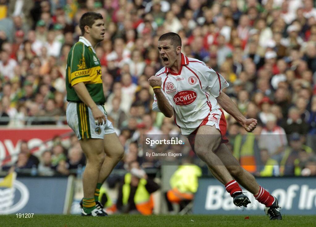 25 September 2005; Philip Jordan, Tyrone, celebrates a late point as Kerry's Eamon Fitzmaurice looks on. Bank of Ireland All-Ireland Senior Football Championship Final, Kerry v Tyrone, Croke Park, Dublin. Picture credit; Damien Eagers/ SPORTSFILE *** Local Caption *** Any photograph taken by SPORTSFILE during, or in connection with, the 2005 Bank of Ireland All-Ireland Senior Football Final which displays GAA logos or contains an image or part of an image of any GAA intellectual property, or, which contains images of a GAA player/players in their playing uniforms, may only be used for editorial and non-advertising purposes.  Use of photographs for advertising, as posters or for purchase separately is strictly prohibited unless prior written approval has been obtained from the Gaelic Athletic Association.