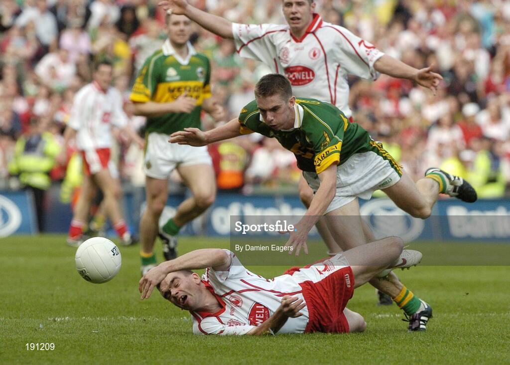 25 September 2005; Ryan McMenamin, Tyrone, in action against Kerry's Marc O'Se. Bank of Ireland All-Ireland Senior Football Championship Final, Kerry v Tyrone, Croke Park, Dublin. Picture credit; Damien Eagers/ SPORTSFILE *** Local Caption *** Any photograph taken by SPORTSFILE during, or in connection with, the 2005 Bank of Ireland All-Ireland Senior Football Final which displays GAA logos or contains an image or part of an image of any GAA intellectual property, or, which contains images of a GAA player/players in their playing uniforms, may only be used for editorial and non-advertising purposes.  Use of photographs for advertising, as posters or for purchase separately is strictly prohibited unless prior written approval has been obtained from the Gaelic Athletic Association.