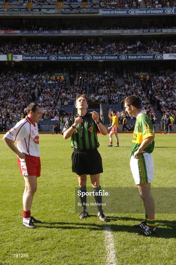 25 September 2005; Referee Michael Monahan tosses the coin in front of Kerry captain Declan O'Sullivan, right, and Tyrone captain Brian Dooher, left. Bank of Ireland All-Ireland Senior Football Championship Final, Kerry v Tyrone, Croke Park, Dublin. Picture credit; Ray McManus / SPORTSFILE *** Local Caption *** Any photograph taken by SPORTSFILE during, or in connection with, the 2005 Bank of Ireland All-Ireland Senior Football Final which displays GAA logos or contains an image or part of an image of any GAA intellectual property, or, which contains images of a GAA player/players in their playing uniforms, may only be used for editorial and non-advertising purposes.  Use of photographs for advertising, as posters or for purchase separately is strictly prohibited unless prior written approval has been obtained from the Gaelic Athletic Association.