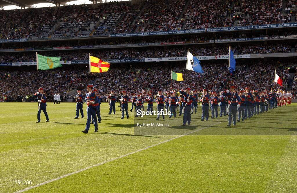 25 September 2005; The Artane Band lead the Kerry and Tyrone teams on the pre-match parade. Bank of Ireland All-Ireland Senior Football Championship Final, Kerry v Tyrone, Croke Park, Dublin. Picture credit; Ray McManus / SPORTSFILE *** Local Caption *** Any photograph taken by SPORTSFILE during, or in connection with, the 2005 Bank of Ireland All-Ireland Senior Football Final which displays GAA logos or contains an image or part of an image of any GAA intellectual property, or, which contains images of a GAA player/players in their playing uniforms, may only be used for editorial and non-advertising purposes.  Use of photographs for advertising, as posters or for purchase separately is strictly prohibited unless prior written approval has been obtained from the Gaelic Athletic Association.