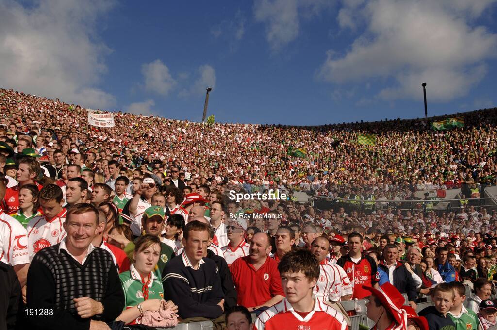 25 September 2005; Tyrone and Kerry supporters watch the game from Hill 16. Bank of Ireland All-Ireland Senior Football Championship Final, Kerry v Tyrone, Croke Park, Dublin. Picture credit; Ray McManus / SPORTSFILE *** Local Caption *** Any photograph taken by SPORTSFILE during, or in connection with, the 2005 Bank of Ireland All-Ireland Senior Football Final which displays GAA logos or contains an image or part of an image of any GAA intellectual property, or, which contains images of a GAA player/players in their playing uniforms, may only be used for editorial and non-advertising purposes.  Use of photographs for advertising, as posters or for purchase separately is strictly prohibited unless prior written approval has been obtained from the Gaelic Athletic Association.