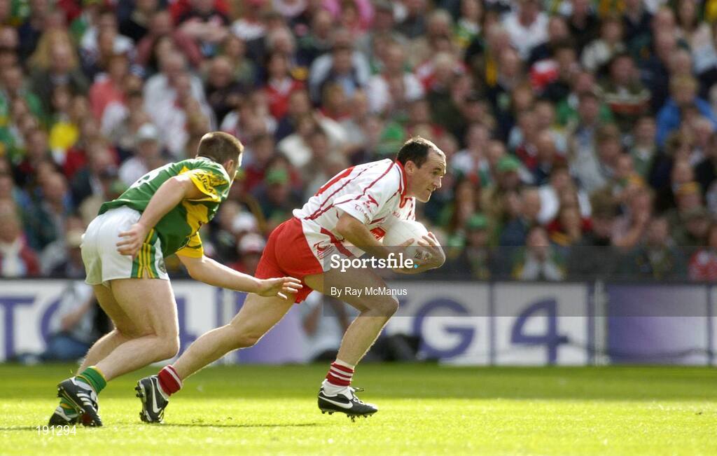 25 September 2005; Brian Dooher, Tyrone, in action against Darragh O Se, Kerry. Bank of Ireland All-Ireland Senior Football Championship Final, Kerry v Tyrone, Croke Park, Dublin. Picture credit; Ray McManus / SPORTSFILE *** Local Caption *** Any photograph taken by SPORTSFILE during, or in connection with, the 2005 Bank of Ireland All-Ireland Senior Football Final which displays GAA logos or contains an image or part of an image of any GAA intellectual property, or, which contains images of a GAA player/players in their playing uniforms, may only be used for editorial and non-advertising purposes.  Use of photographs for advertising, as posters or for purchase separately is strictly prohibited unless prior written approval has been obtained from the Gaelic Athletic Association.