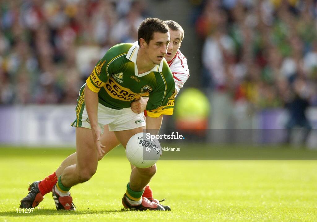 25 September 2005; Paul Galvin, Kerry, in action against Brian McGuigan, Tyrone. Bank of Ireland All-Ireland Senior Football Championship Final, Kerry v Tyrone, Croke Park, Dublin. Picture credit; Ray McManus / SPORTSFILE *** Local Caption *** Any photograph taken by SPORTSFILE during, or in connection with, the 2005 Bank of Ireland All-Ireland Senior Football Final which displays GAA logos or contains an image or part of an image of any GAA intellectual property, or, which contains images of a GAA player/players in their playing uniforms, may only be used for editorial and non-advertising purposes.  Use of photographs for advertising, as posters or for purchase separately is strictly prohibited unless prior written approval has been obtained from the Gaelic Athletic Association.