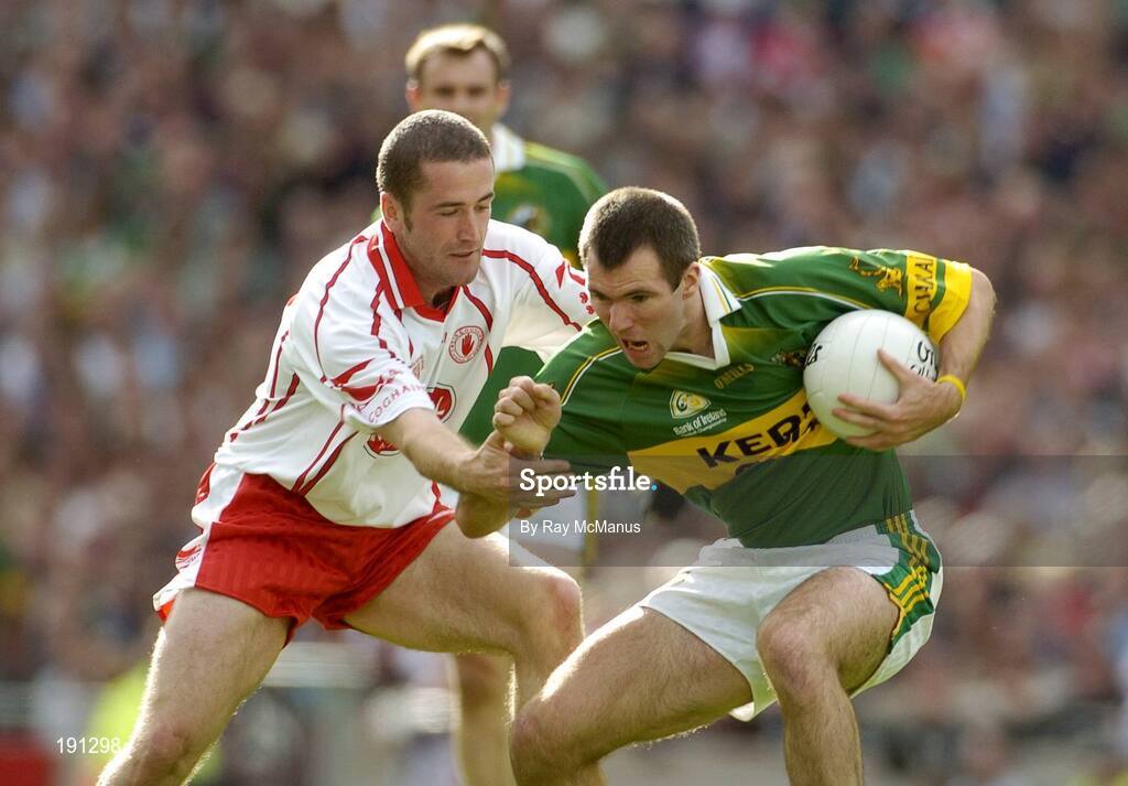 25 September 2005; Michael McCarthy, Kerry, in action against Stephen O'Neill, Tyrone. Bank of Ireland All-Ireland Senior Football Championship Final, Kerry v Tyrone, Croke Park, Dublin. Picture credit; Ray McManus / SPORTSFILE *** Local Caption *** Any photograph taken by SPORTSFILE during, or in connection with, the 2005 Bank of Ireland All-Ireland Senior Football Final which displays GAA logos or contains an image or part of an image of any GAA intellectual property, or, which contains images of a GAA player/players in their playing uniforms, may only be used for editorial and non-advertising purposes.  Use of photographs for advertising, as posters or for purchase separately is strictly prohibited unless prior written approval has been obtained from the Gaelic Athletic Association.