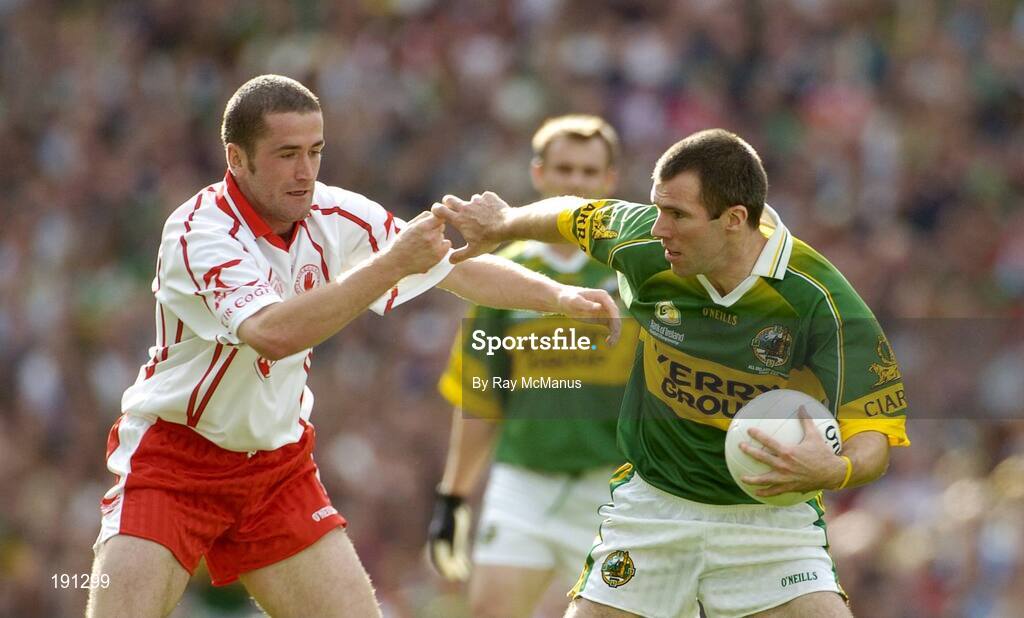 25 September 2005; Michael McCarthy, Kerry, in action against Stephen O'Neill, Tyrone. Bank of Ireland All-Ireland Senior Football Championship Final, Kerry v Tyrone, Croke Park, Dublin. Picture credit; Ray McManus / SPORTSFILE *** Local Caption *** Any photograph taken by SPORTSFILE during, or in connection with, the 2005 Bank of Ireland All-Ireland Senior Football Final which displays GAA logos or contains an image or part of an image of any GAA intellectual property, or, which contains images of a GAA player/players in their playing uniforms, may only be used for editorial and non-advertising purposes.  Use of photographs for advertising, as posters or for purchase separately is strictly prohibited unless prior written approval has been obtained from the Gaelic Athletic Association.