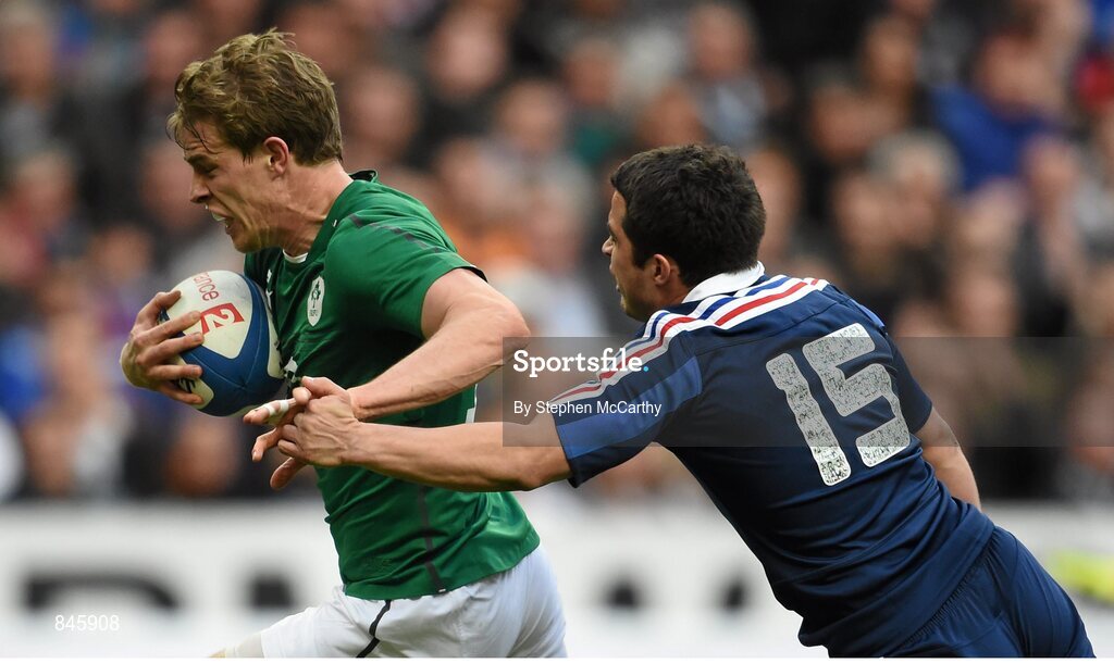 15 March 2014; Andrew Trimble, Ireland, runs in for his side's second try despite Brice Dulin, France. RBS Six Nations Rugby Championship 2014, France v Ireland, Stade De France, Saint Denis, Paris, France. Picture credit: Stephen McCarthy / SPORTSFILE