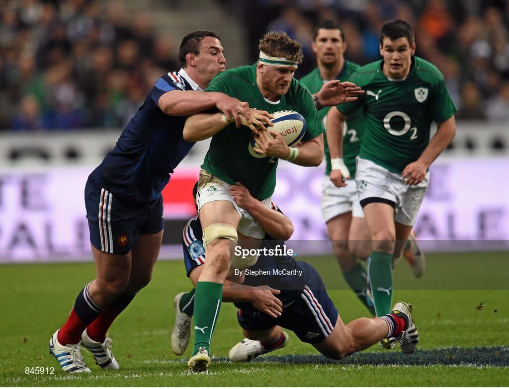15 March 2014; Jamie Heaslip, Ireland, is tackled by Louis Picamoles, left, and Rabah Slimani, France. RBS Six Nations Rugby Championship 2014, France v Ireland, Stade De France, Saint Denis, Paris, France. Picture credit: Stephen McCarthy / SPORTSFILE