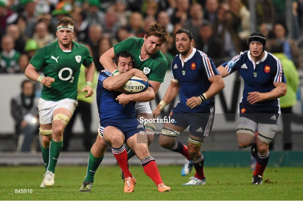 15 March 2014; Jean-Marc Doussain, France, is tackled by Iain Henderson, Ireland. RBS Six Nations Rugby Championship 2014, France v Ireland, Stade De France, Saint Denis, Paris, France. Picture credit: Stephen McCarthy / SPORTSFILE
