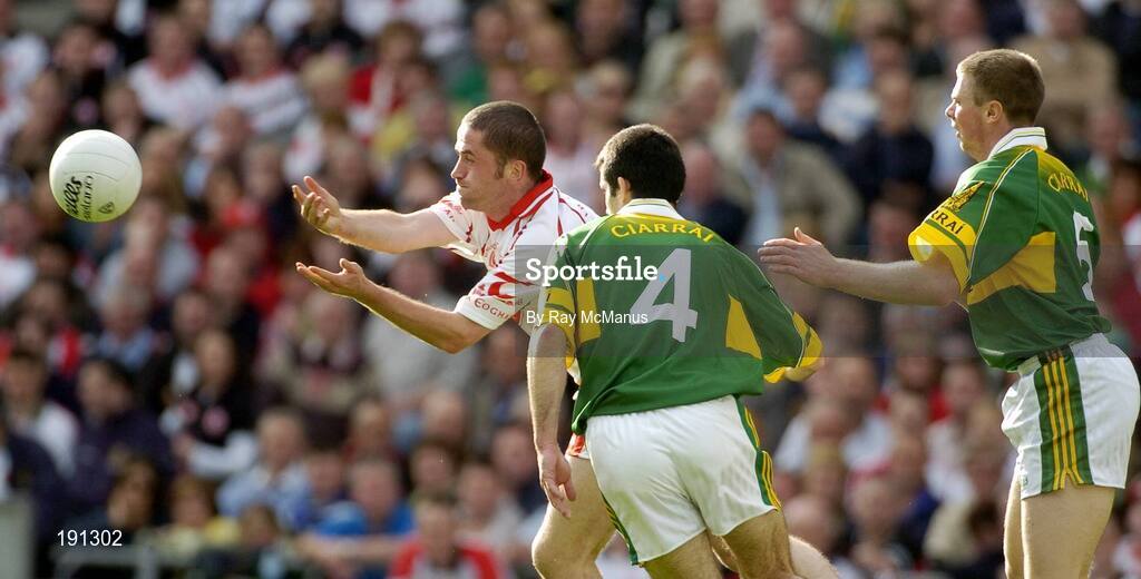 25 September 2005; Stephen O'Neill, Tyrone, in action against Tom O'Sullivan, 4, and Tomas O Se, Kerry, Kerry v Tyrone. Bank of Ireland All-Ireland Senior Football Championship Final, Kerry v Tyrone, Croke Park, Dublin. Picture credit; Ray McManus / SPORTSFILE *** Local Caption *** Any photograph taken by SPORTSFILE during, or in connection with, the 2005 Bank of Ireland All-Ireland Senior Football Final which displays GAA logos or contains an image or part of an image of any GAA intellectual property, or, which contains images of a GAA player/players in their playing uniforms, may only be used for editorial and non-advertising purposes.  Use of photographs for advertising, as posters or for purchase separately is strictly prohibited unless prior written approval has been obtained from the Gaelic Athletic Association.