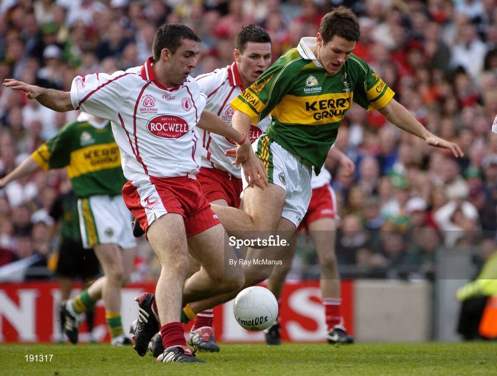 25 September 2005; Eoin Brosnan, Kerry, in action against Michael McGee, Tyrone. Bank of Ireland All-Ireland Senior Football Championship Final, Kerry v Tyrone, Croke Park, Dublin. Picture credit; Ray McManus / SPORTSFILE *** Local Caption *** Any photograph taken by SPORTSFILE during, or in connection with, the 2005 Bank of Ireland All-Ireland Senior Football Final which displays GAA logos or contains an image or part of an image of any GAA intellectual property, or, which contains images of a GAA player/players in their playing uniforms, may only be used for editorial and non-advertising purposes.  Use of photographs for advertising, as posters or for purchase separately is strictly prohibited unless prior written approval has been obtained from the Gaelic Athletic Association.