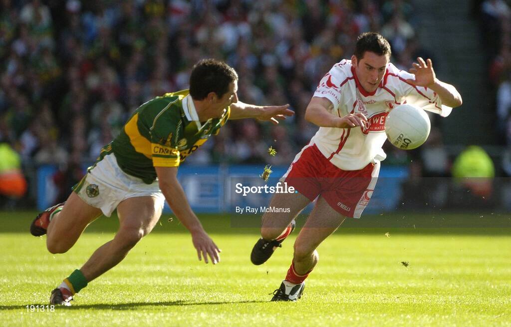 25 September 2005; Davy Harte, Tyrone, in action against Paul Galvin, Kerry. Bank of Ireland All-Ireland Senior Football Championship Final, Kerry v Tyrone, Croke Park, Dublin. Picture credit; Ray McManus / SPORTSFILE *** Local Caption *** Any photograph taken by SPORTSFILE during, or in connection with, the 2005 Bank of Ireland All-Ireland Senior Football Final which displays GAA logos or contains an image or part of an image of any GAA intellectual property, or, which contains images of a GAA player/players in their playing uniforms, may only be used for editorial and non-advertising purposes.  Use of photographs for advertising, as posters or for purchase separately is strictly prohibited unless prior written approval has been obtained from the Gaelic Athletic Association.
