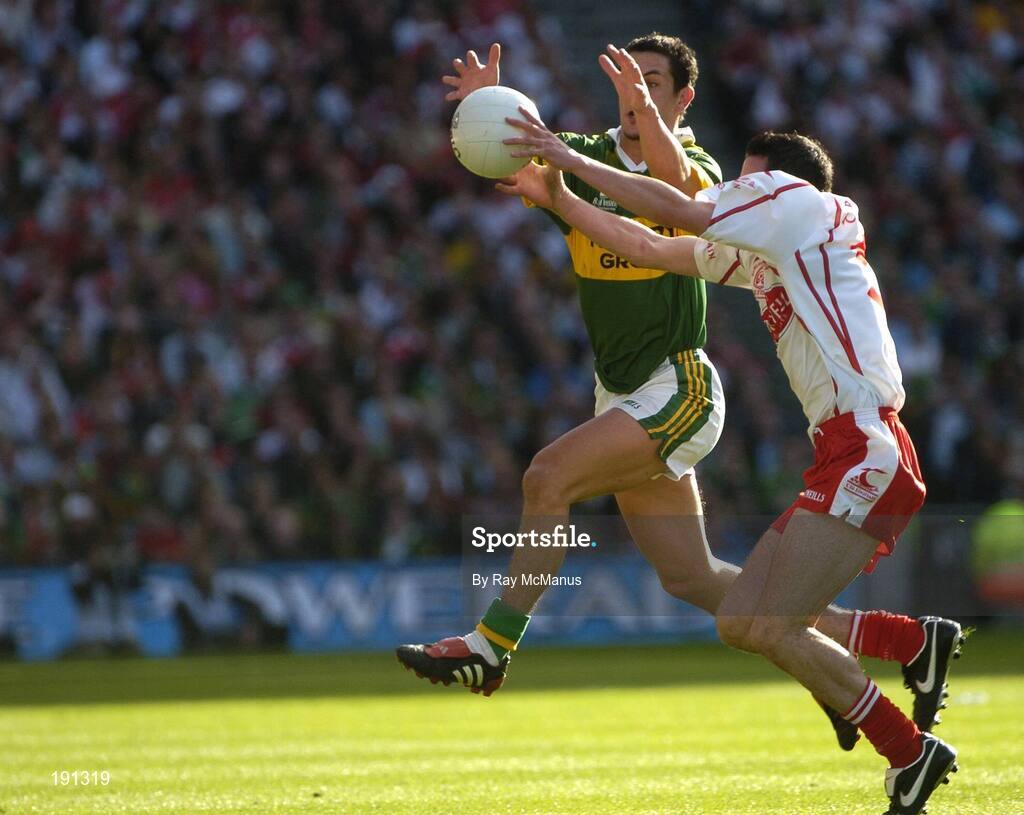 25 September 2005; Davy Harte, Tyrone, in action against Paul Galvin, Kerry. Bank of Ireland All-Ireland Senior Football Championship Final, Kerry v Tyrone, Croke Park, Dublin. Picture credit; Ray McManus / SPORTSFILE *** Local Caption *** Any photograph taken by SPORTSFILE during, or in connection with, the 2005 Bank of Ireland All-Ireland Senior Football Final which displays GAA logos or contains an image or part of an image of any GAA intellectual property, or, which contains images of a GAA player/players in their playing uniforms, may only be used for editorial and non-advertising purposes.  Use of photographs for advertising, as posters or for purchase separately is strictly prohibited unless prior written approval has been obtained from the Gaelic Athletic Association.