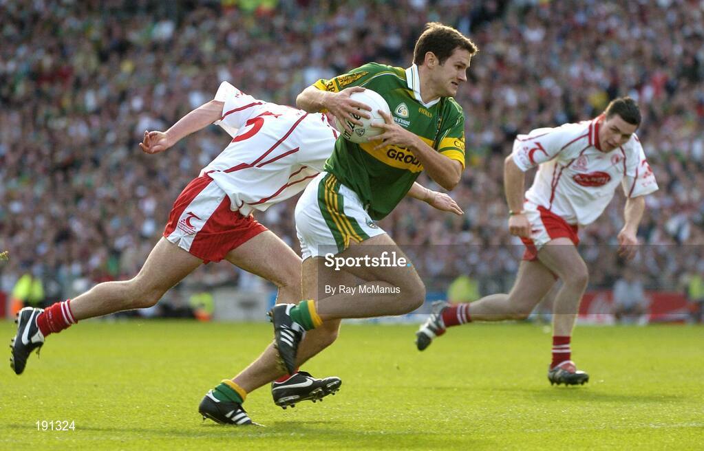 25 September 2005; Eoin Brosnan, Kerry, in action against Davy Harte, Tyrone. Bank of Ireland All-Ireland Senior Football Championship Final, Kerry v Tyrone, Croke Park, Dublin. Picture credit; Ray McManus / SPORTSFILE *** Local Caption *** Any photograph taken by SPORTSFILE during, or in connection with, the 2005 Bank of Ireland All-Ireland Senior Football Final which displays GAA logos or contains an image or part of an image of any GAA intellectual property, or, which contains images of a GAA player/players in their playing uniforms, may only be used for editorial and non-advertising purposes.  Use of photographs for advertising, as posters or for purchase separately is strictly prohibited unless prior written approval has been obtained from the Gaelic Athletic Association.