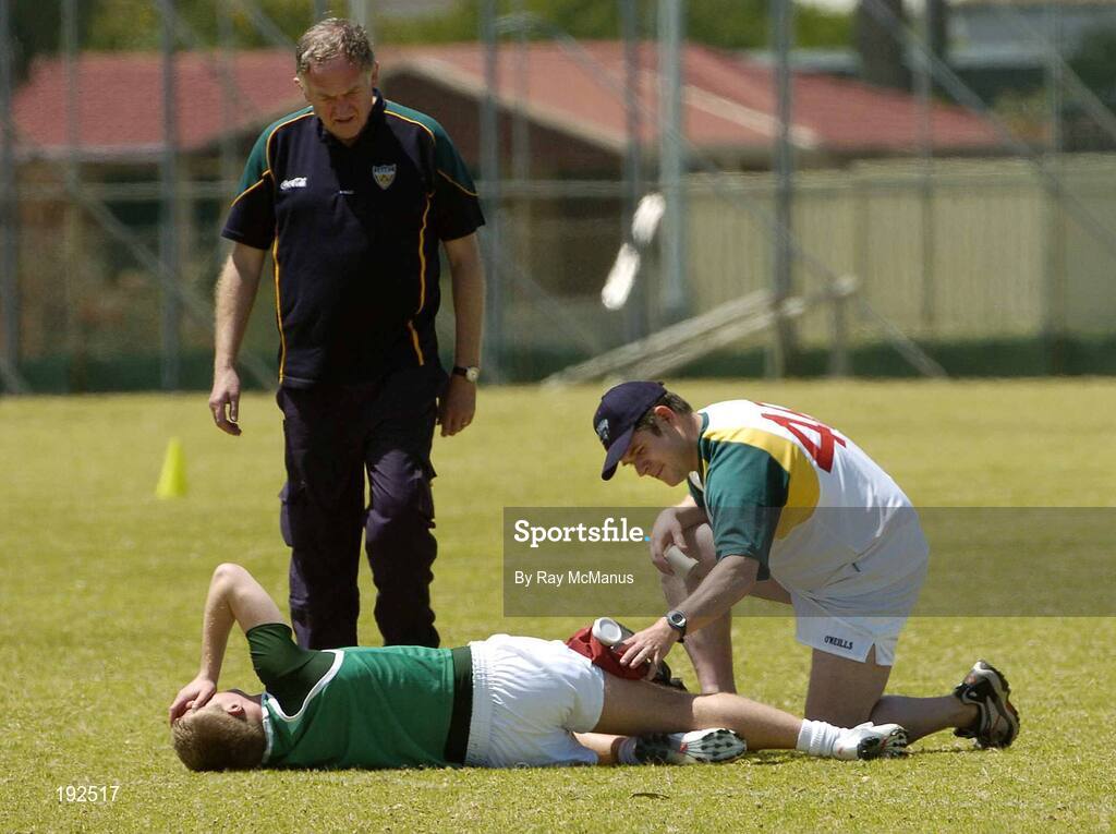 18 October 2005; Ross Munnelly, Laois, is attended to by Eoghan O'Neill, right, and Dr Con Murphy during a training session, at the Mandurah Football and Sports Club, in advance of the Fosters International Rules game between Australia and Ireland. Mandurah Football and Sports Club, Rushton Park, Mandurah, Perth, Western Australia. Picture credit; Ray McManus / SPORTSFILE