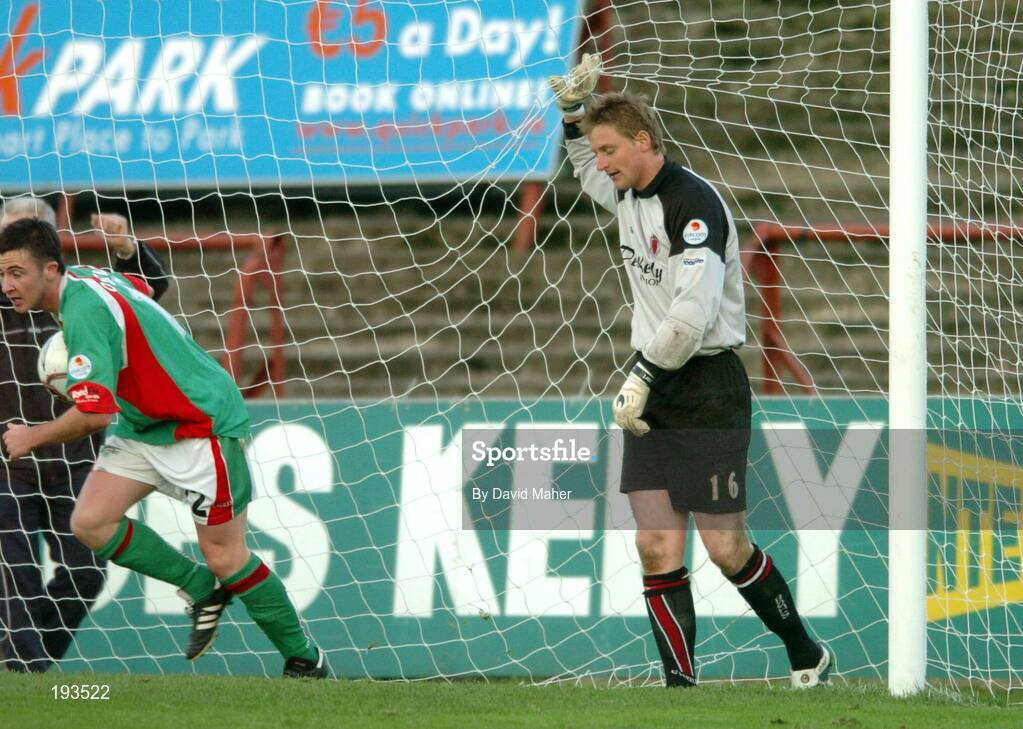 31 October 2005; A dejected Bohemians goalkeeper Matt Gregg, holds the net after his mistake lead to Cork City's first goal with Roy O'Donovan, far right, Cork City. eircom League, Premier Division, Bohemians v Cork City, Dalymount Park, Dublin. Picture credit: David Maher / SPORTSFILE