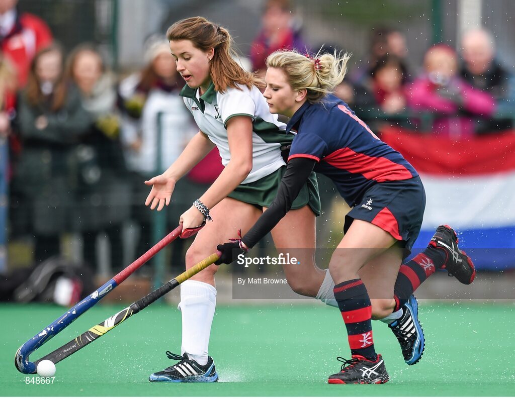 28 March 2014; Lillian Matthews, Salerno, in action against Judith Edgar, Lurgan College.  Electric Ireland Kate Russell All-Ireland School Girls Hockey Final Tournament, Salerno, Co. Galway v Lurgan College, Co. Armagh. St Andrews College, Booterstown, Co Dublin. Picture credit: Matt Browne / SPORTSFILE