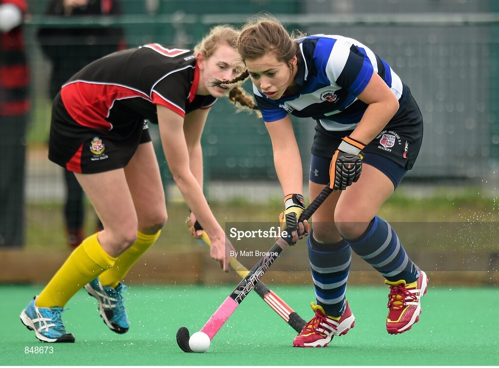 28 March 2014; Michelle Barrett, Crescent College, in action against Cheyenne Holmes, Kilkenny College. Electric Ireland Kate Russell All-Ireland School Girls Hockey Final Tournament, Crescent College, Co. Limerick v Kilkenny College, Co. Kilkenny. St Andrews College, Booterstown, Co. Dublin. Picture credit: Matt Browne / SPORTSFILE