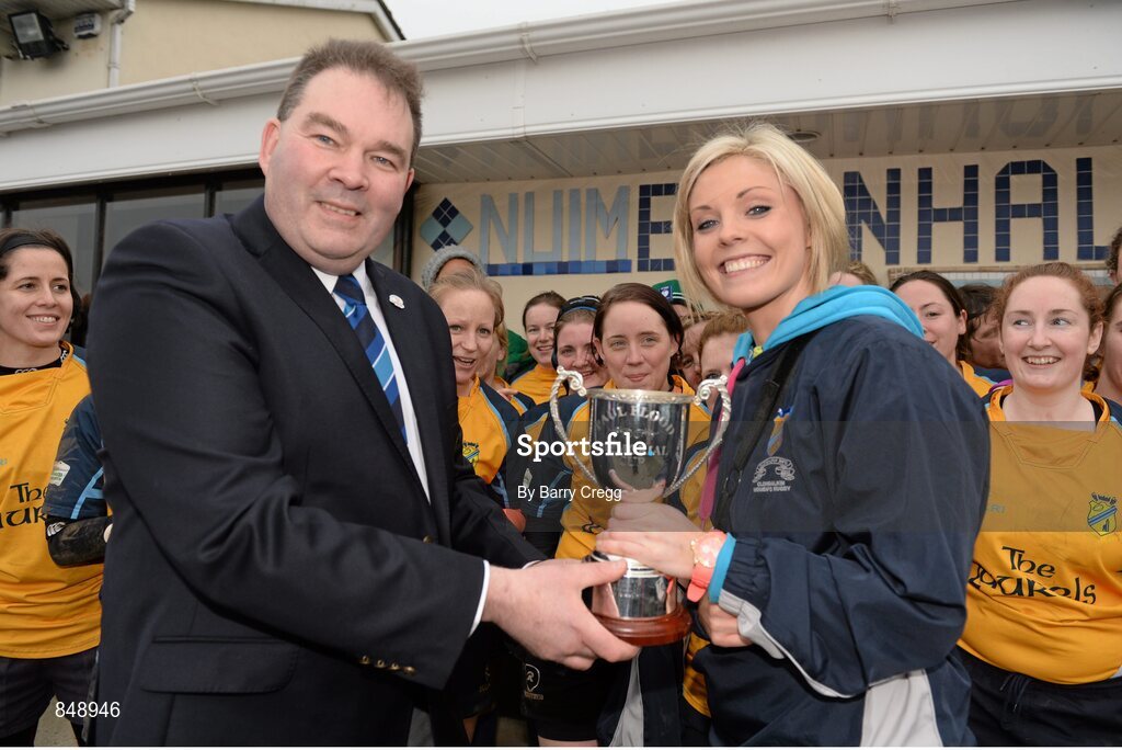 29 March 2014; Clondalkin captain Shona Byrne is presented with the Paul Flood Cup by Rob McDermott, Leinster Rugby, after the game. The Paul Flood Cup Final, Clondalkin v Gorey, NUIM Barhnall RFC, Leixlip, Co. Kildare. Picture credit: Barry Cregg / SPORTSFILE