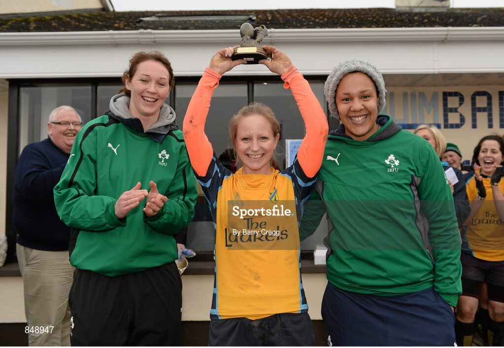 29 March 2014; Sara Phelan, Clondalkin, lifts her Player of the Match award alongside Ireland Internationals Marie Louise Reilly, left, and Sophie Spence after the game. The Paul Flood Cup Final, Clondalkin v Gorey, NUIM Barhnall RFC, Leixlip, Co. Kildare. Picture credit: Barry Cregg / SPORTSFILE