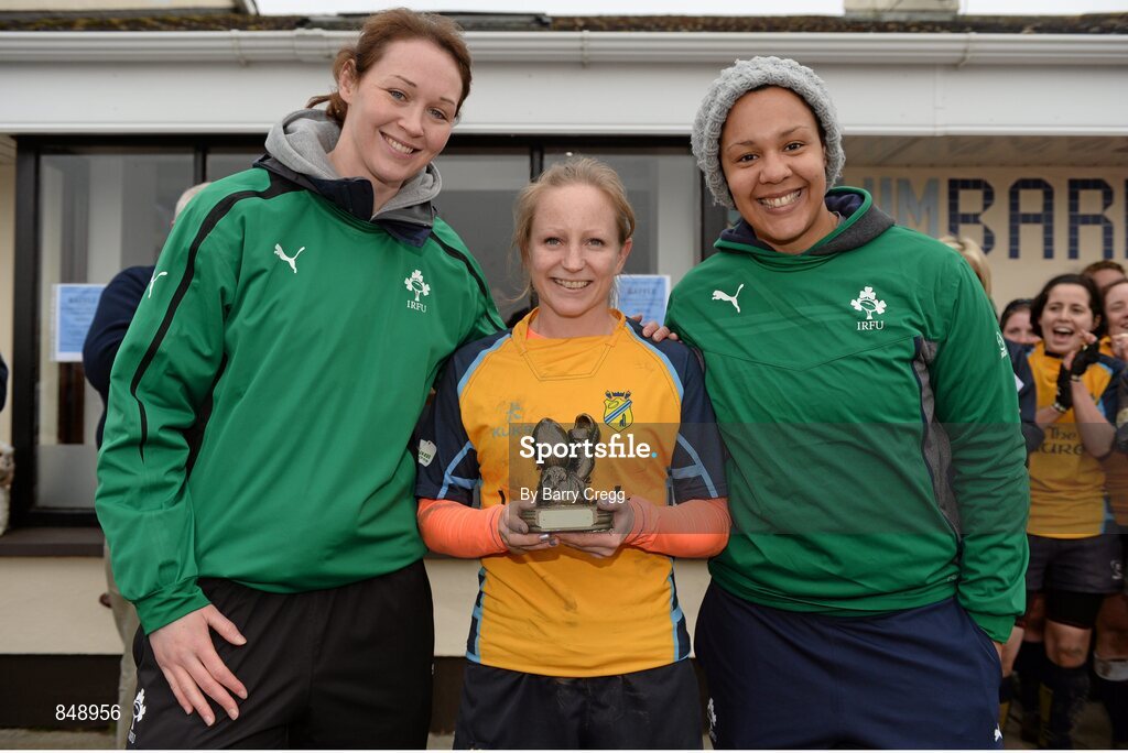 29 March 2014; Sara Phelan, Clondalkin, lifts her Player of the Match award alongside Ireland Internationals Marie Louise Reilly, left, and Sophie Spence after the game. The Paul Flood Cup Final, Clondalkin v Gorey, NUIM Barhnall RFC, Leixlip, Co. Kildare. Picture credit: Barry Cregg / SPORTSFILE