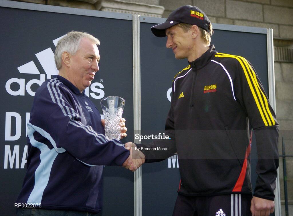 31 October 2005; 3rd placed Oleg Belhovets of Russia, is presented with his trophy by Robin Money, Head of Sports Marketing, adidas Area North, during the 2005 adidas Dublin City Marathon. Picture credit: Brendan Moran / SPORTSFILE