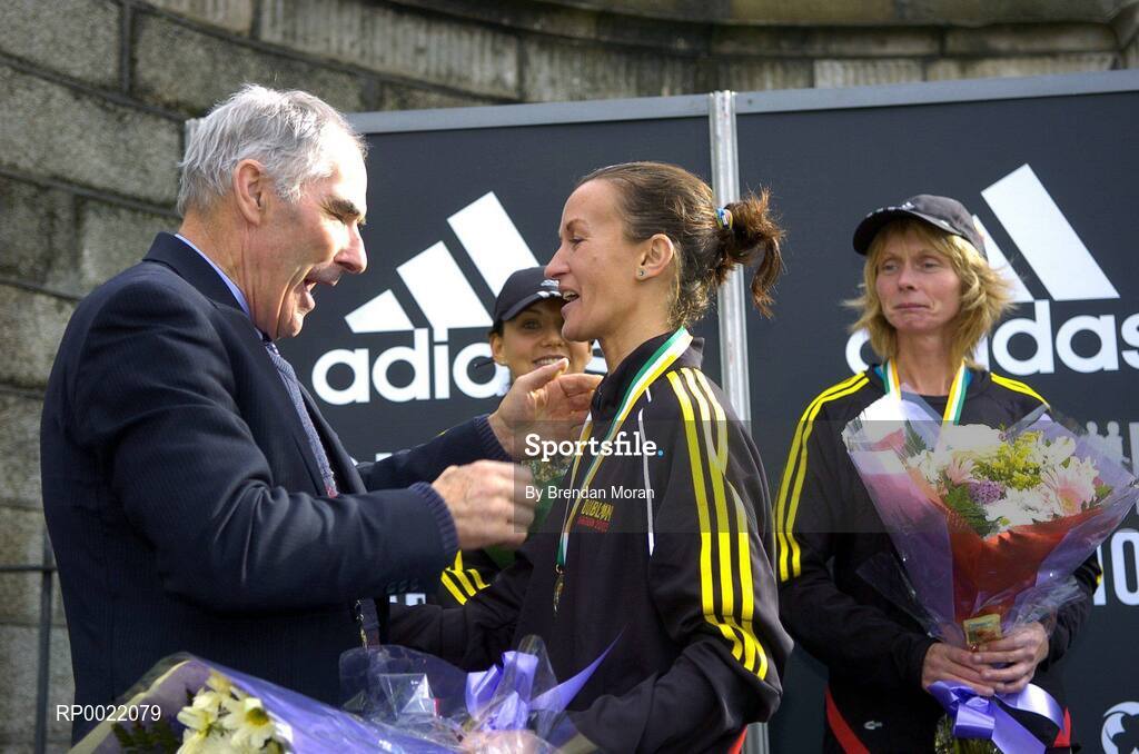 31 October 2005; Pauline Curley is presented with her medal as National Women's Marathon Champion by Michael Heery, President of the AAI, after finishing as first Irish woman home, during the 2005 adidas Dublin City Marathon. Picture credit: Brendan Moran / SPORTSFILE